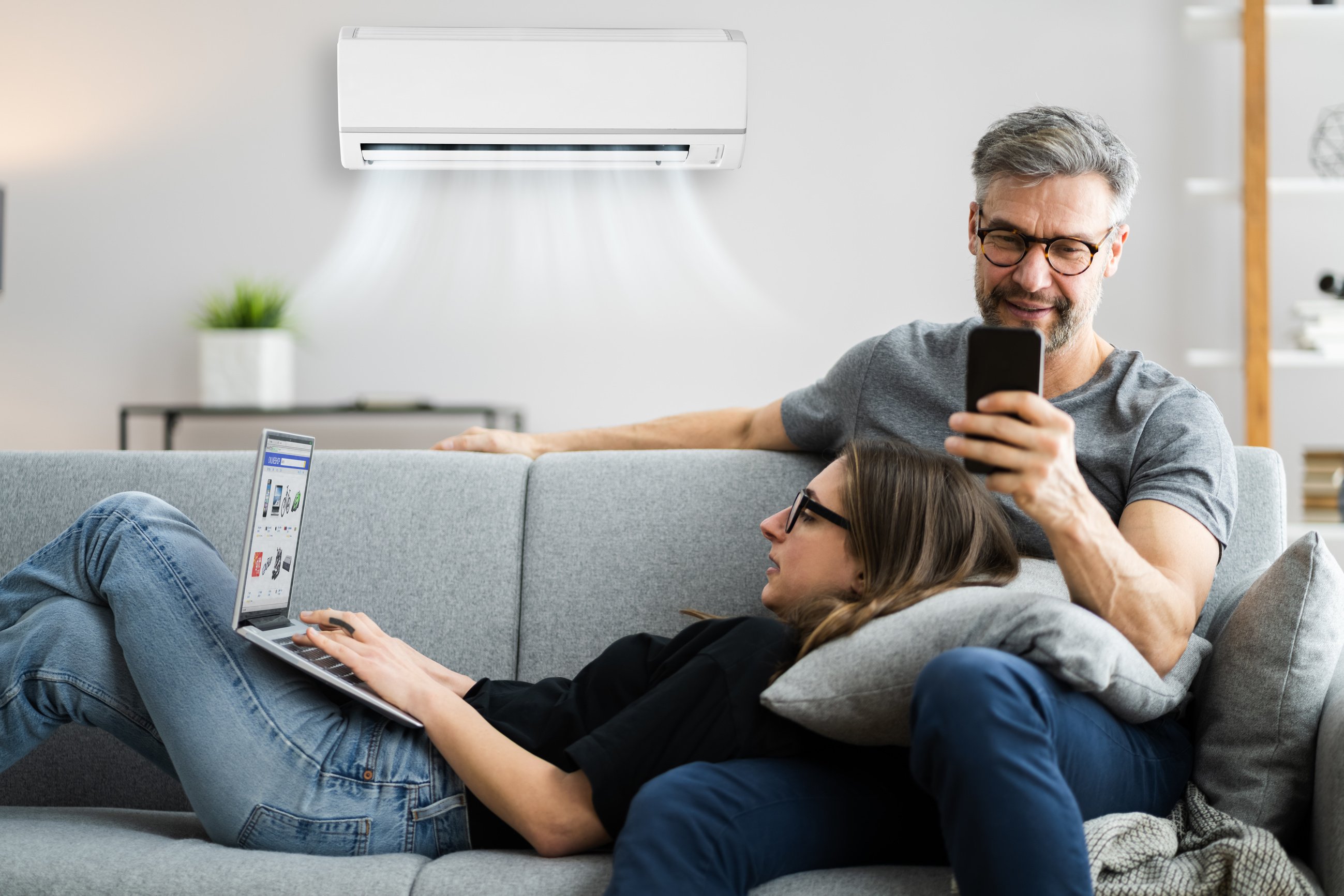 Happy Family Using Air Condition